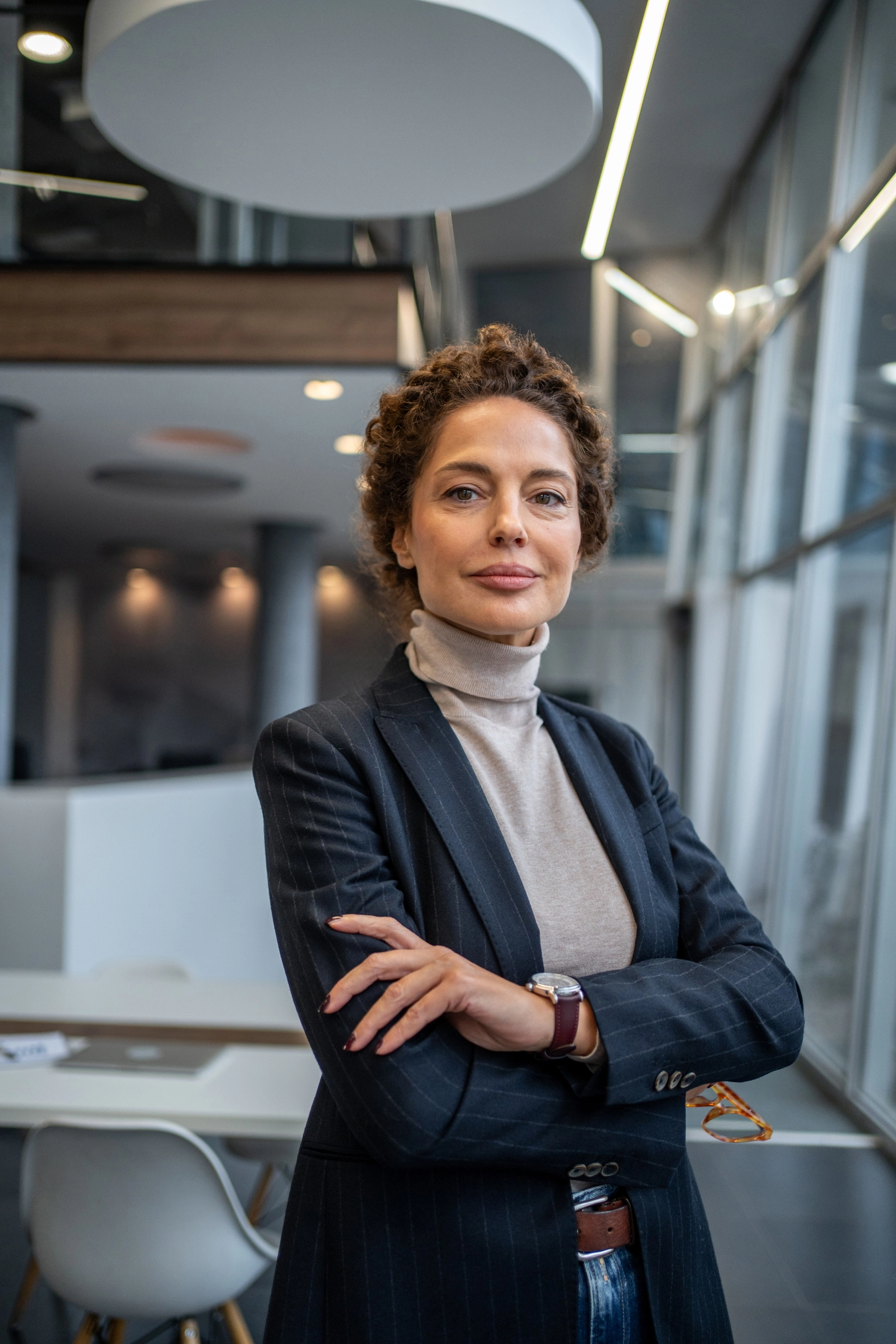 woman in blazer with arms crossed